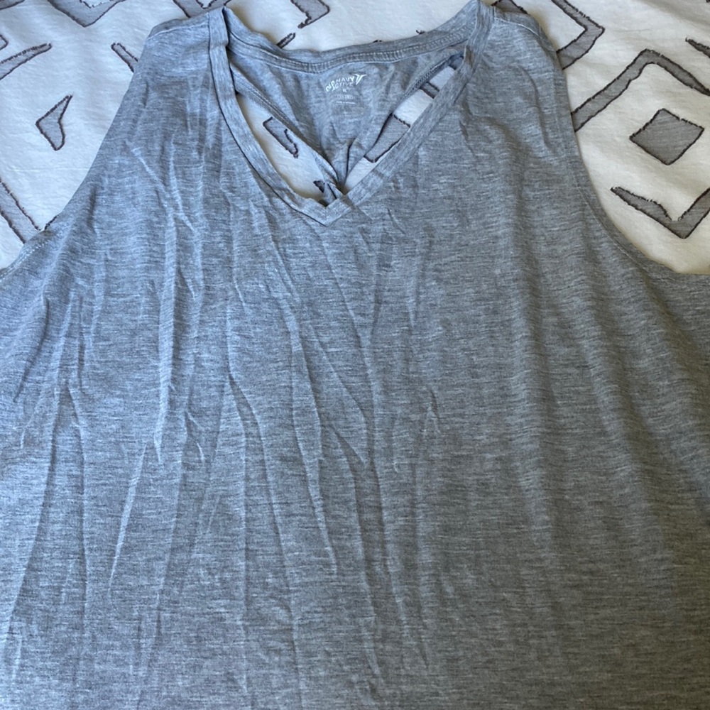 Plain grey tank top with cute twist detail on racer back section.